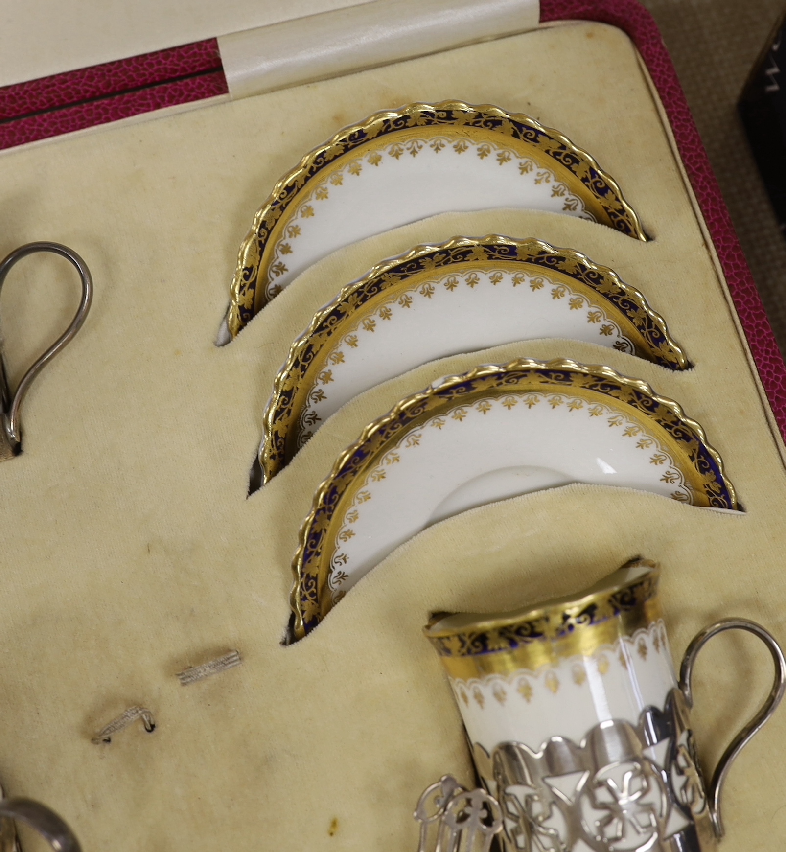A cased George Jones Crescent China silver mounted coffee set, marks for Alexander Clark Co Ltd Sheffield 1928